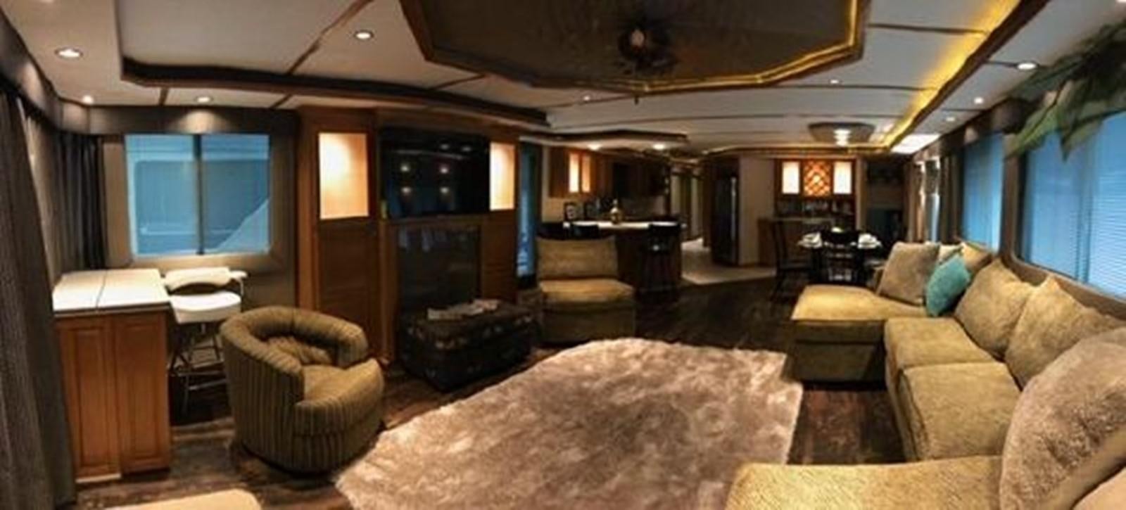 a living room with a large rug aboard FANTASY HOUSEBOAT Yacht for Sale