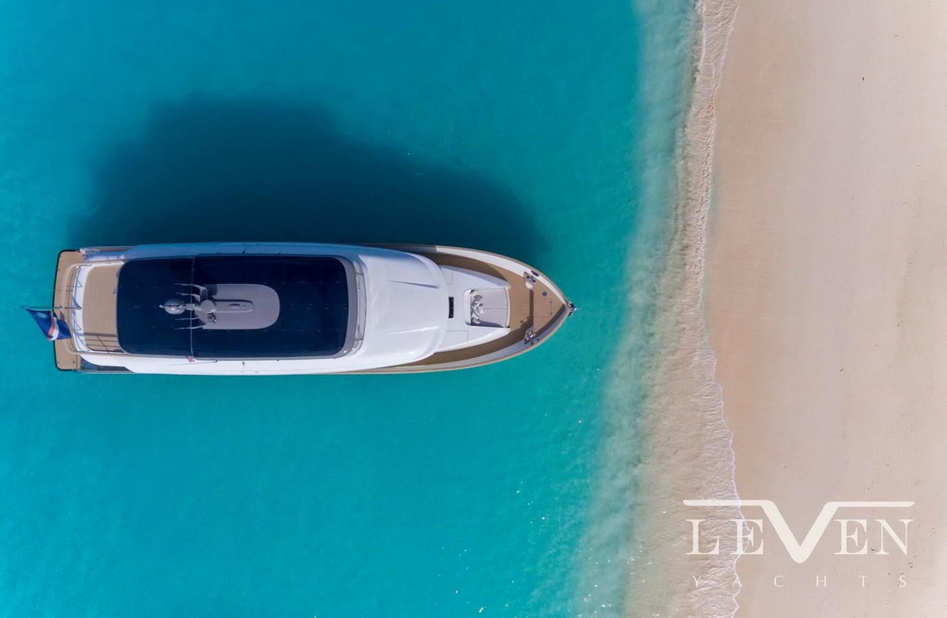 a silver car on a green surface aboard LEVEN 90 Yacht for Sale