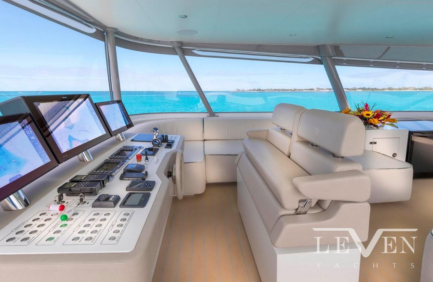 a room with a couch and a computer aboard LEVEN 90 Yacht for Sale