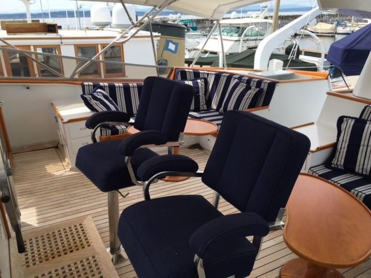 a group of chairs in a room aboard ALEXIS Yacht for Sale