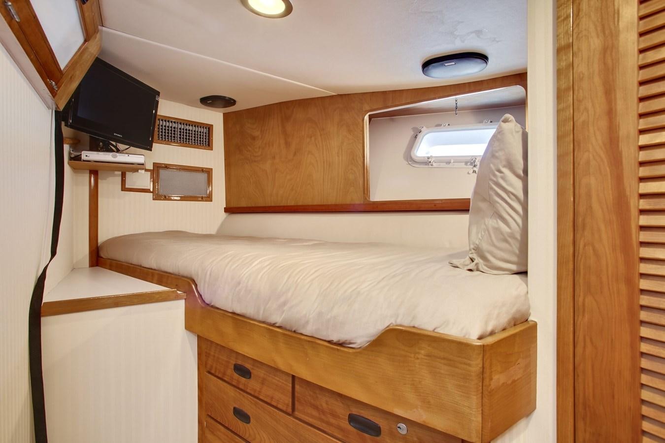 a bed in a room aboard ALEXIS Yacht for Sale