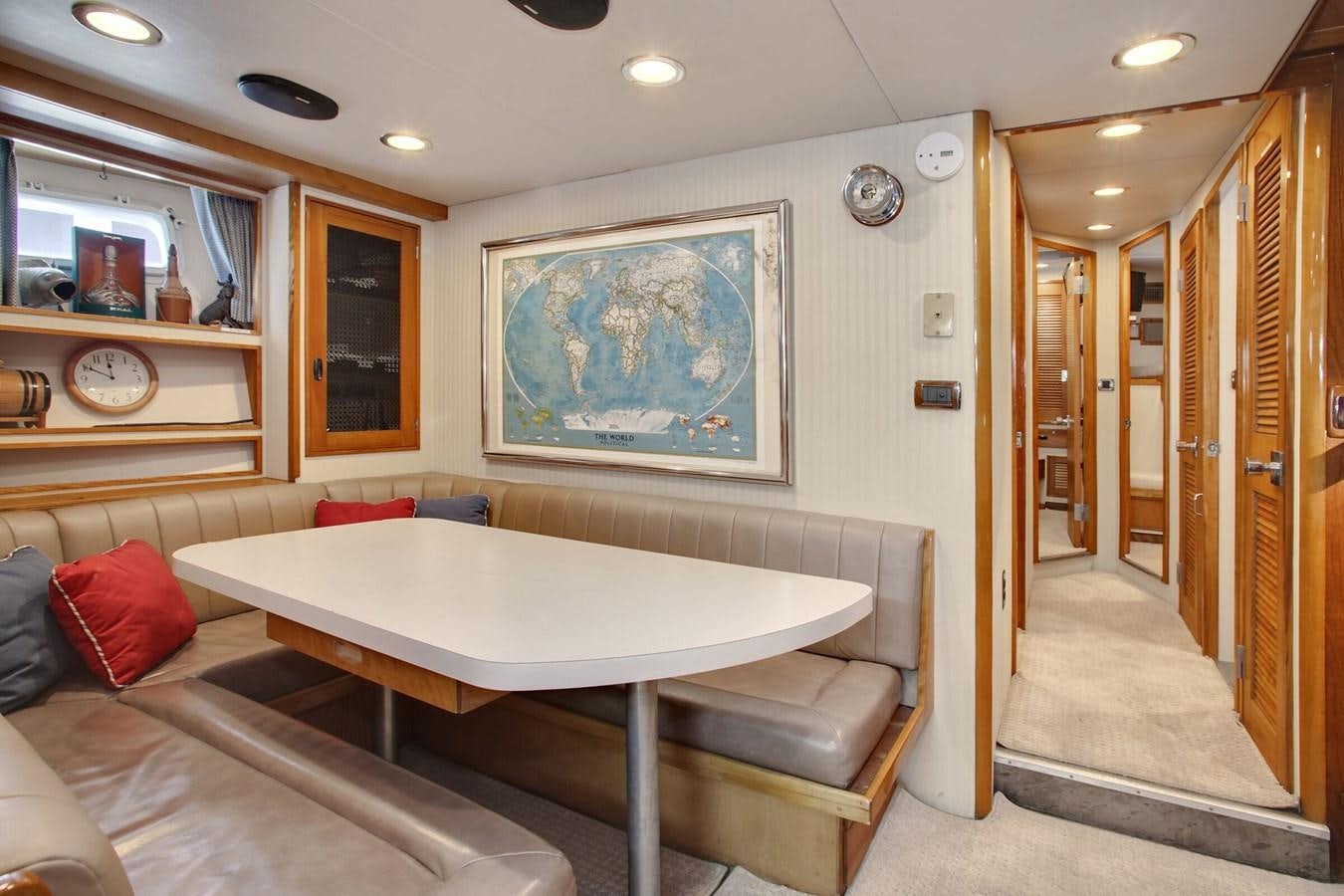a room with a table and couch aboard ALEXIS Yacht for Sale