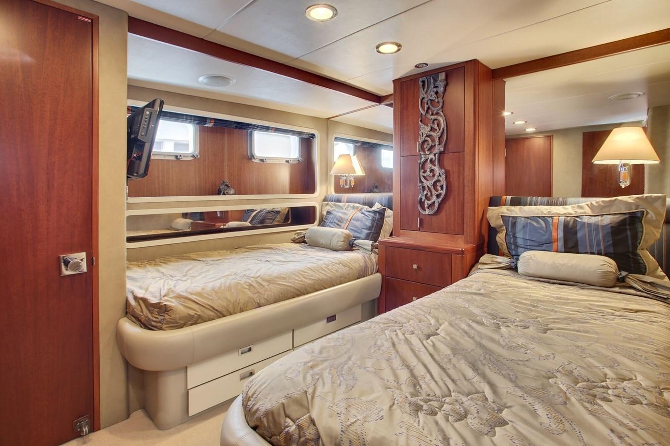 a room with a couple of beds aboard ALEXIS Yacht for Sale