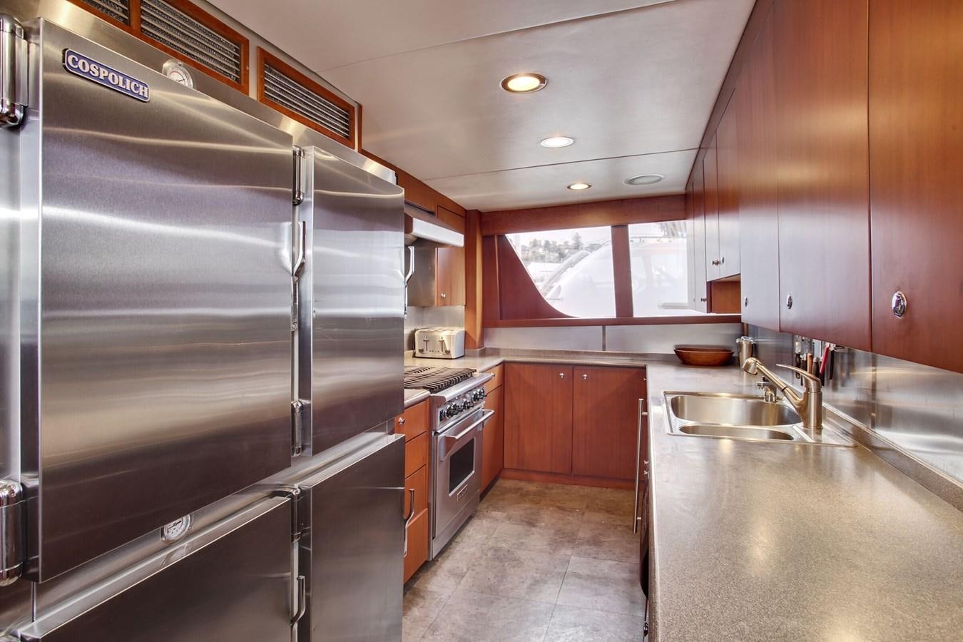 a kitchen with stainless steel appliances aboard ALEXIS Yacht for Sale