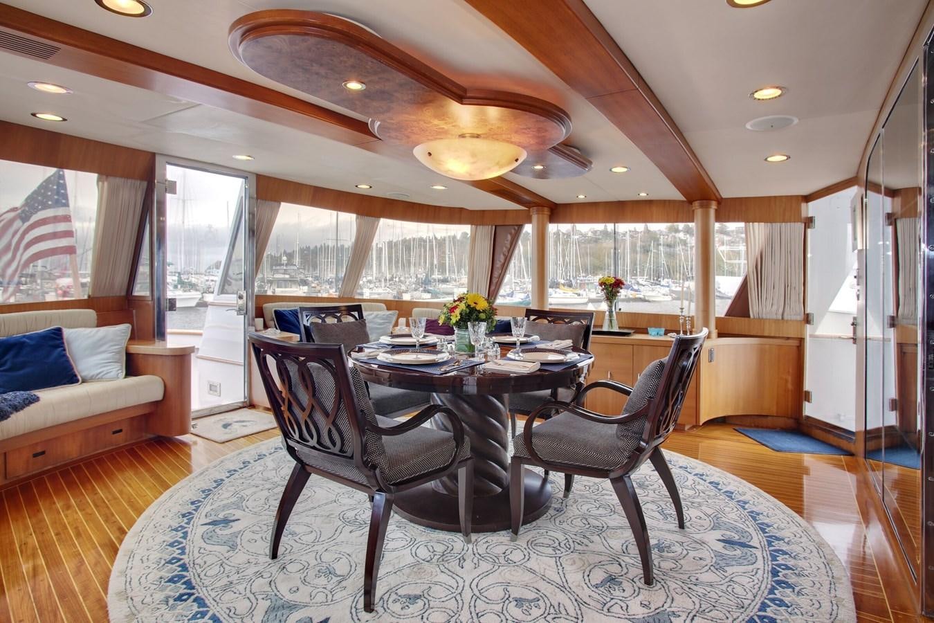 a large dining room with a large table and chairs aboard ALEXIS Yacht for Sale