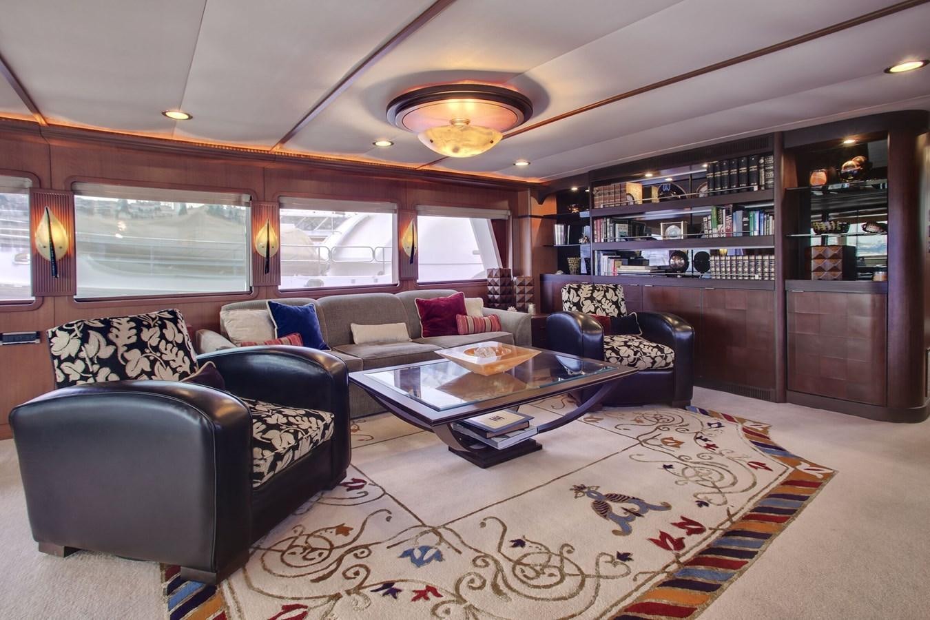 a living room with leather couches aboard ALEXIS Yacht for Sale