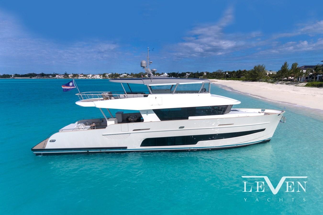 a white yacht on a beach aboard LEVEN 90 LV01 Yacht for Sale