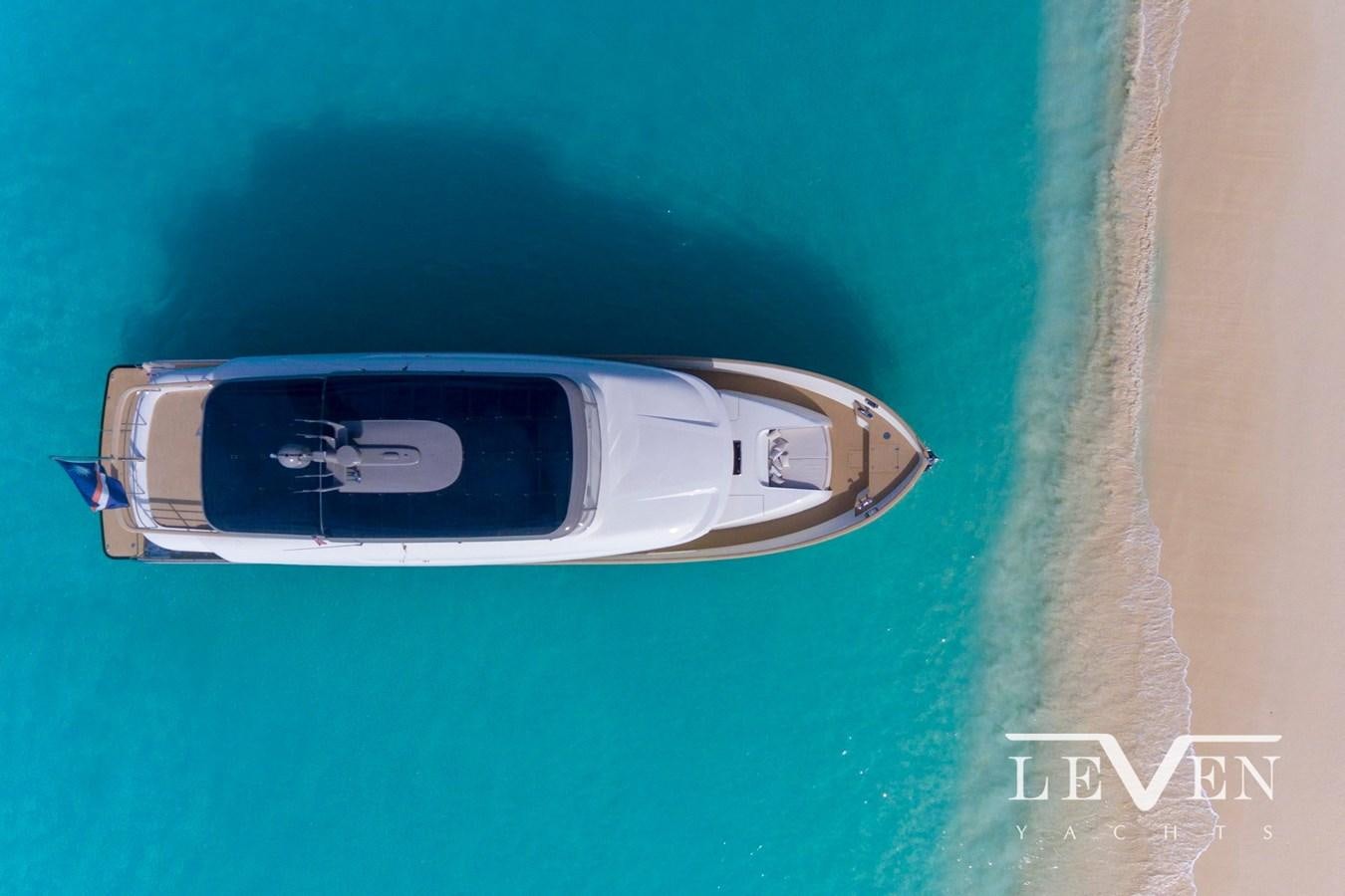 a silver car on a green surface aboard LEVEN 90 LV01 Yacht for Sale