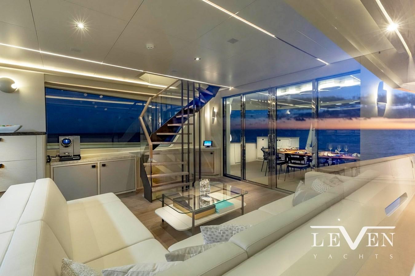 a room with a staircase and glass walls aboard LEVEN 90 LV01 Yacht for Sale