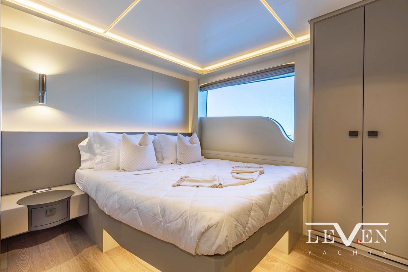 a bed in a room aboard LEVEN 90 LV01 Yacht for Sale