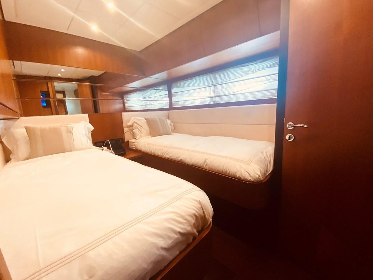 a room with two beds aboard ROMPEMAR Yacht for Sale