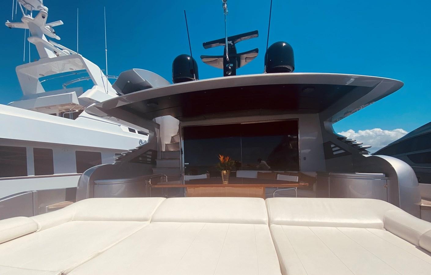 a white building with a black and white roof and a satellite dish on top of it aboard ROMPEMAR Yacht for Sale