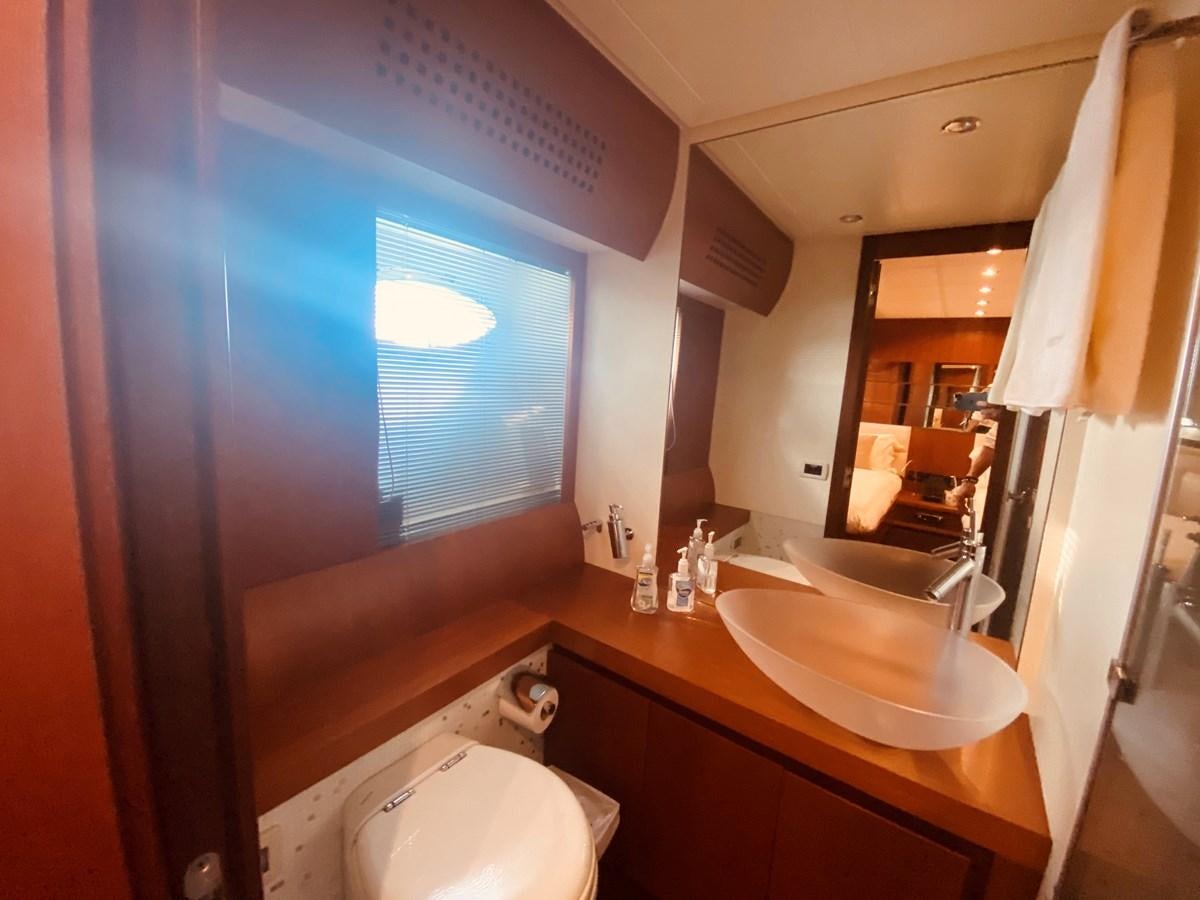a bathroom with a large window aboard ROMPEMAR Yacht for Sale