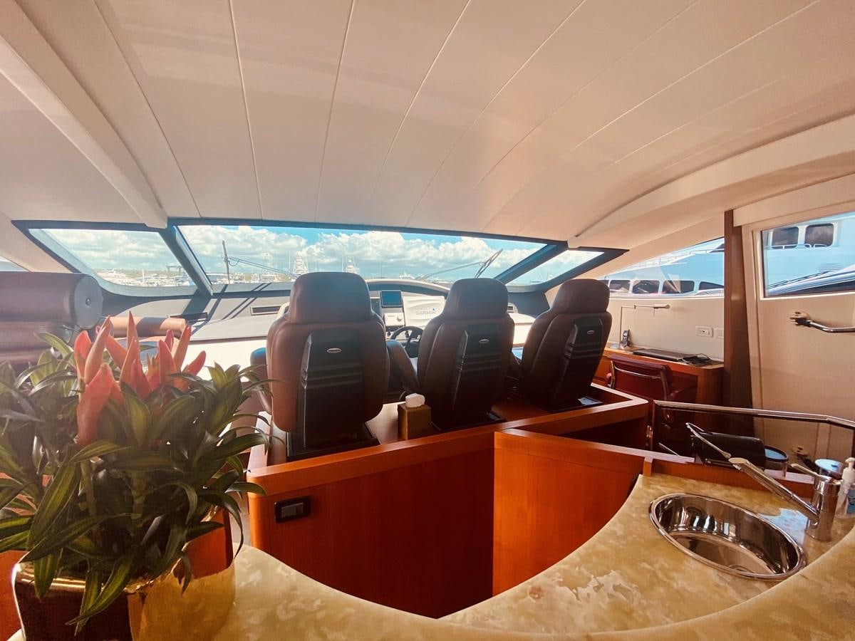 inside of a vehicle with a planter and chairs aboard ROMPEMAR Yacht for Sale