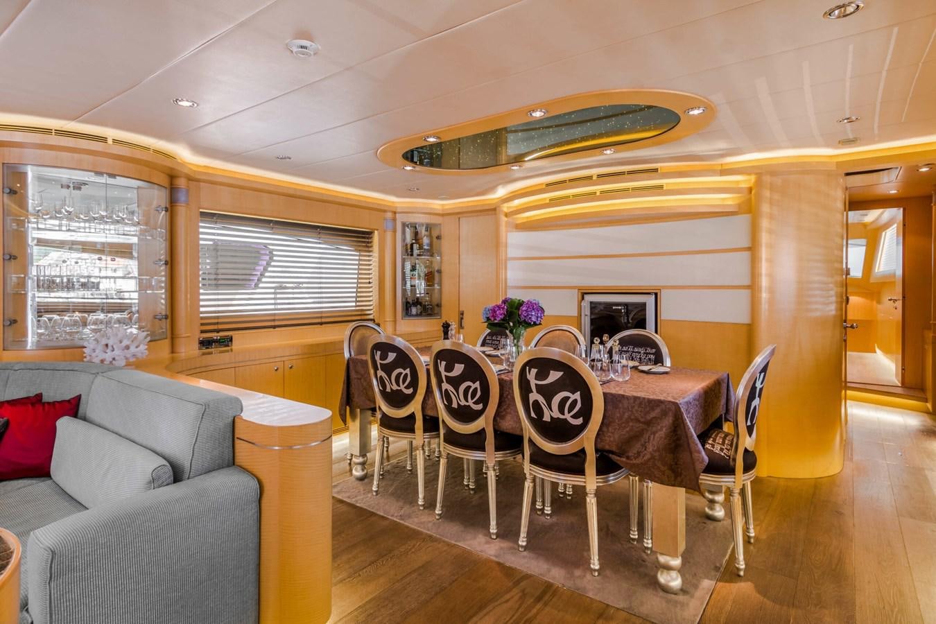 a dining room with a table and chairs aboard CONTE ALBERTI Yacht for Sale