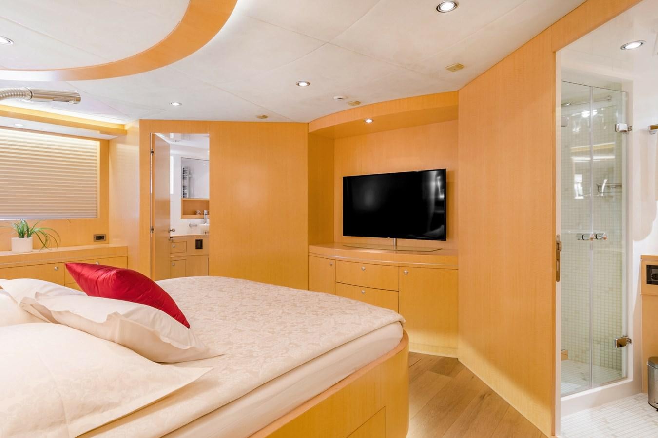 a bedroom with a bed and tv aboard CONTE ALBERTI Yacht for Sale