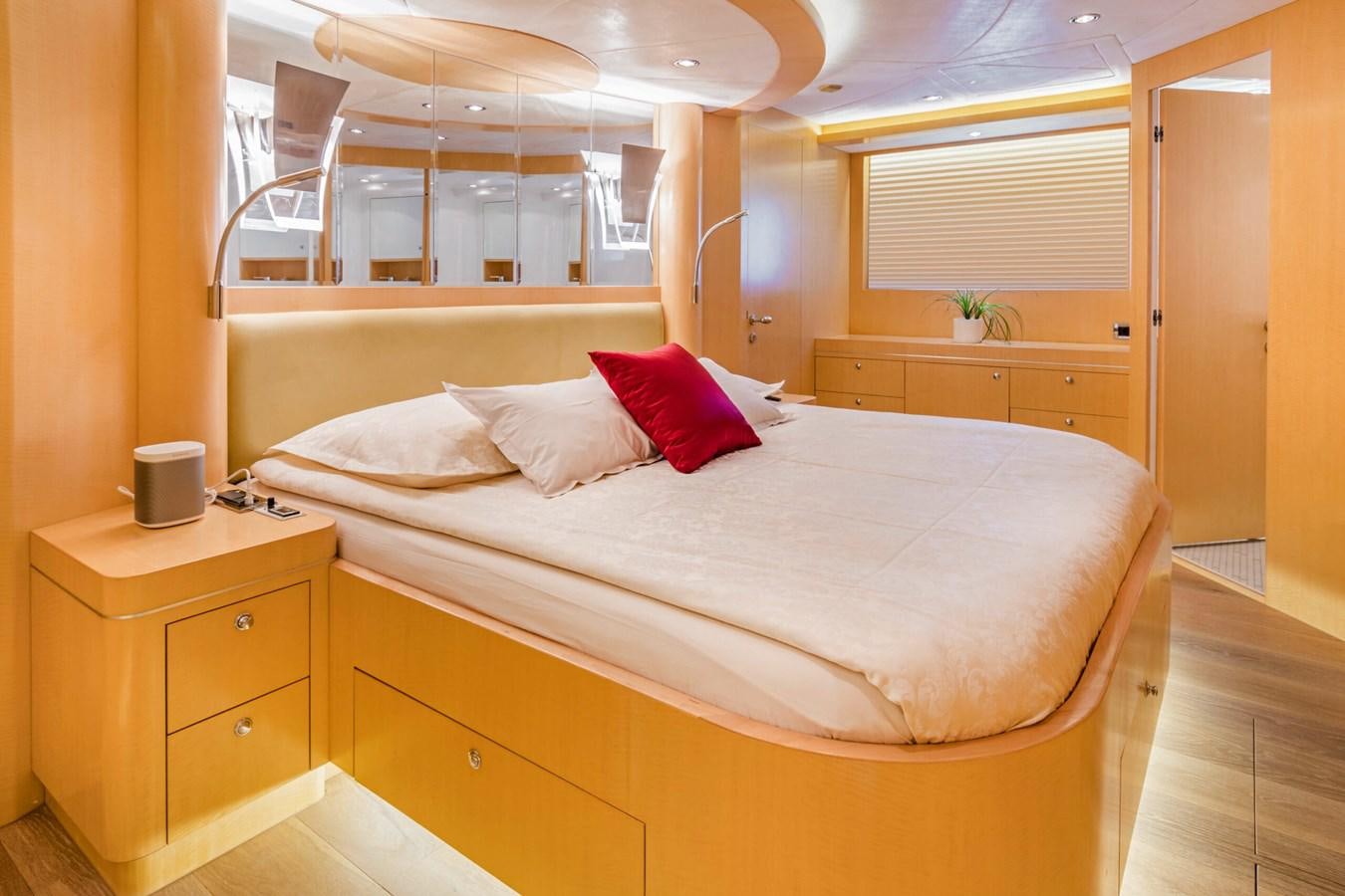 a bed with white sheets and pillows aboard CONTE ALBERTI Yacht for Sale