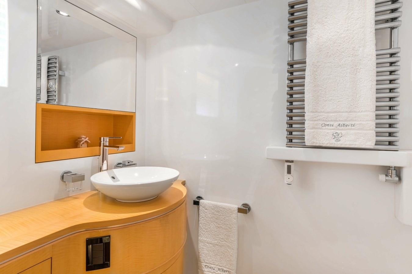 a bathroom with a sink and towels aboard CONTE ALBERTI Yacht for Sale