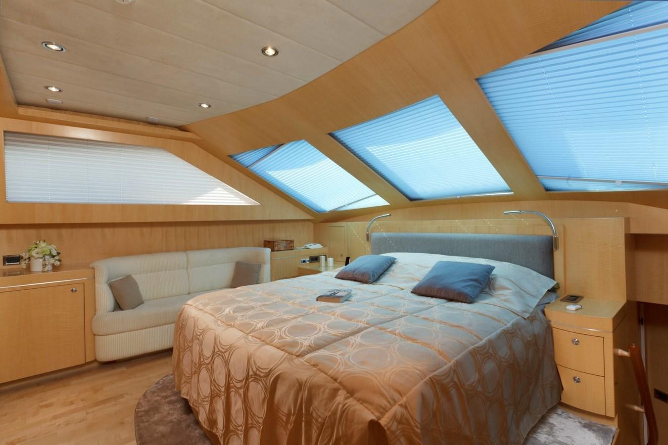 a room with a bed and a couch aboard CONTE ALBERTI Yacht for Sale