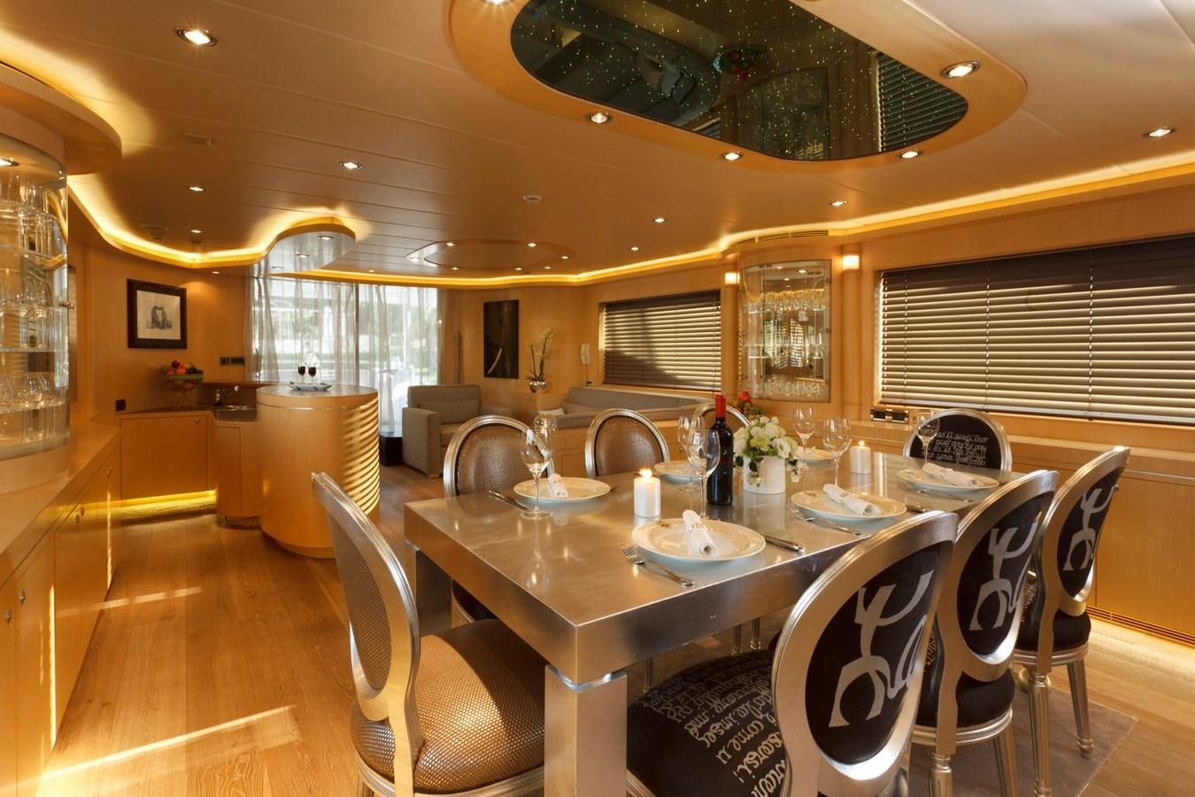 a dining room with a table and chairs aboard CONTE ALBERTI Yacht for Sale