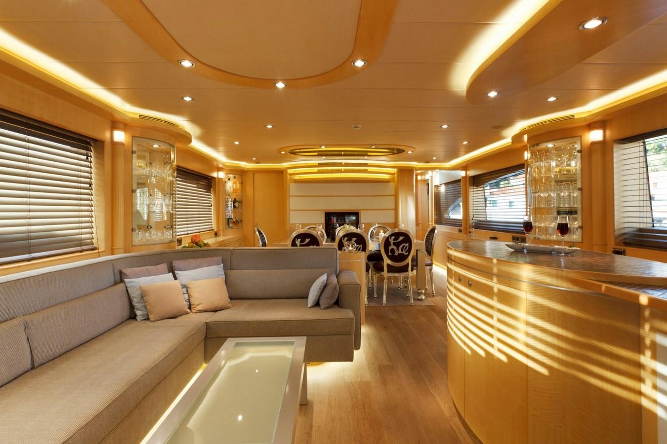 a large living room with a wood floor aboard CONTE ALBERTI Yacht for Sale