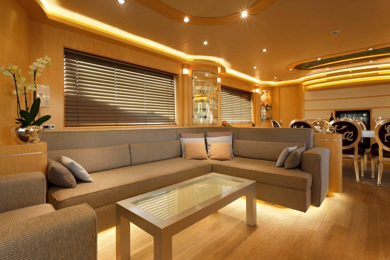 a living room with a couch and a coffee table aboard CONTE ALBERTI Yacht for Sale