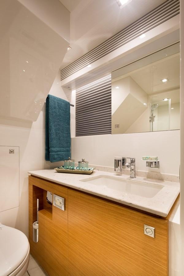 a bathroom with a sink and a mirror aboard FD90  (NEW BOAT SPEC)  Yacht for Sale