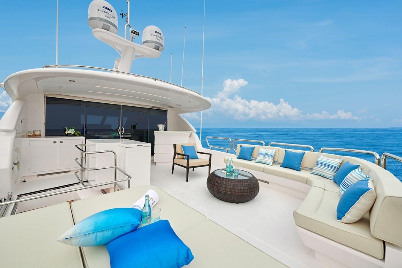a white lounge chair on a white table next to a white table with blue chairs and a white aboard FD90  (NEW BOAT SPEC)  Yacht for Sale