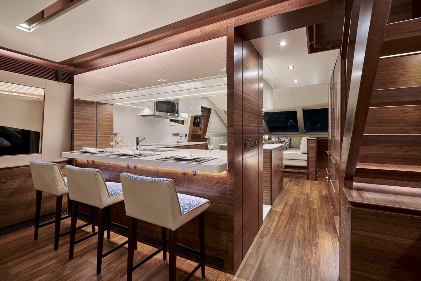 a kitchen with a table and chairs aboard FD90  (NEW BOAT SPEC)  Yacht for Sale
