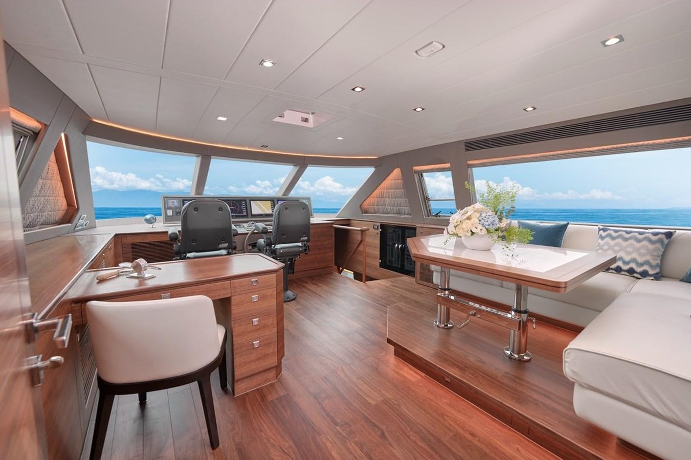 a room with a table and chairs aboard FD90  (NEW BOAT SPEC)  Yacht for Sale