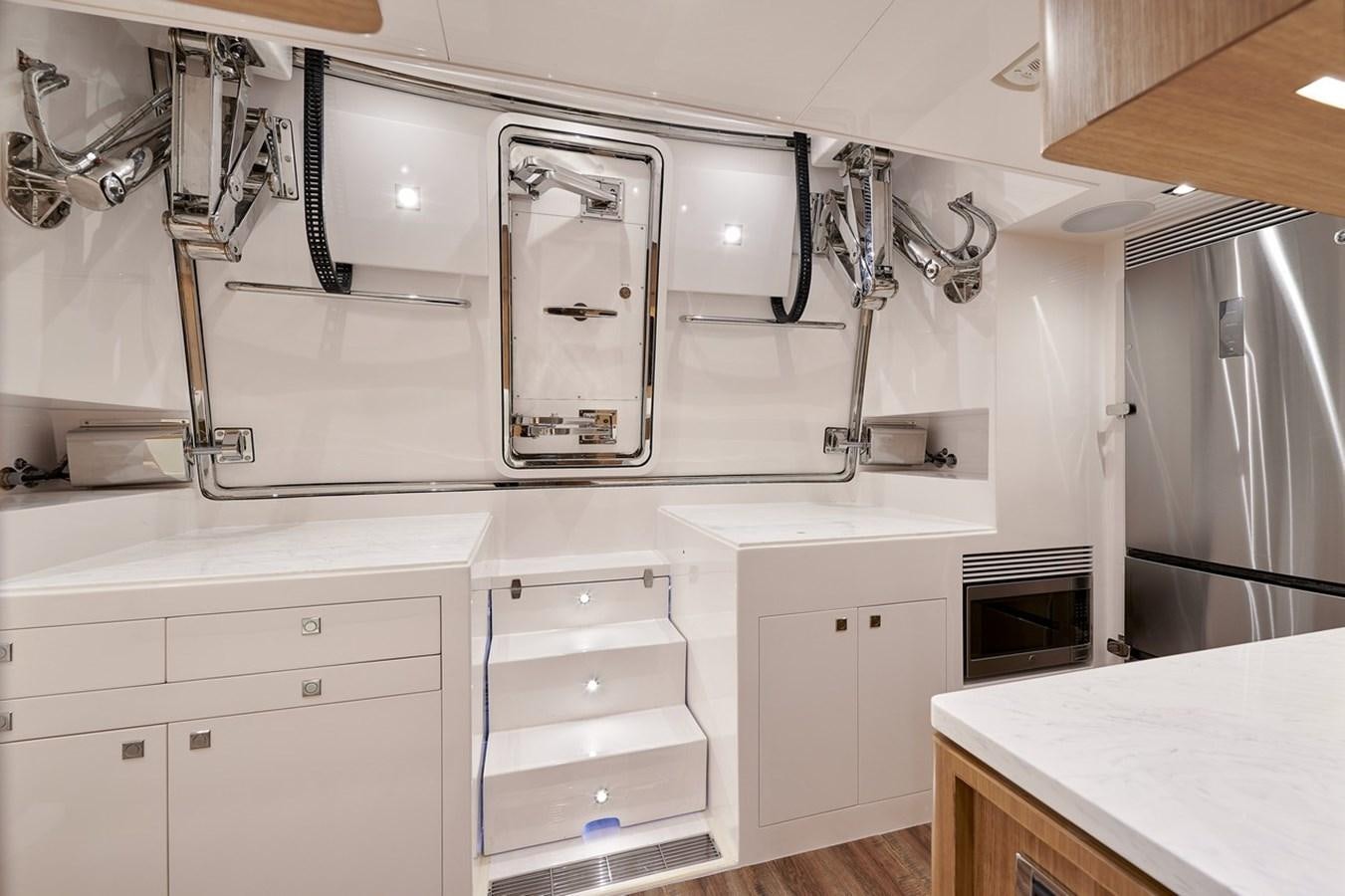a kitchen with white cabinets aboard FD90  (NEW BOAT SPEC)  Yacht for Sale