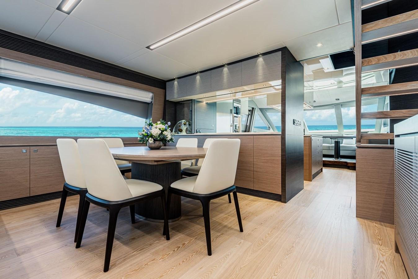 a room with a table and chairs aboard FD90  (NEW BOAT SPEC)  Yacht for Sale