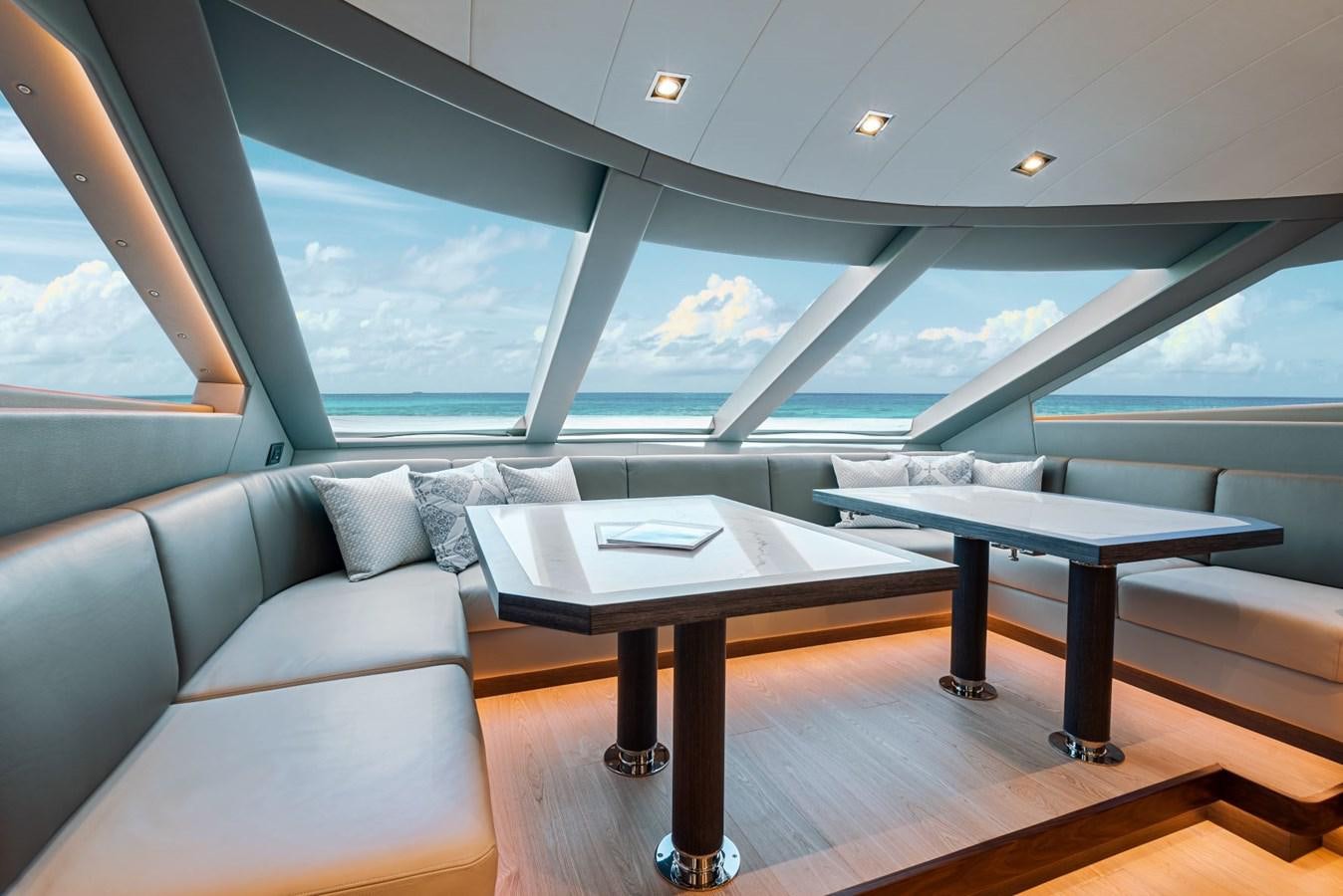 a table and couch in a room aboard FD90  (NEW BOAT SPEC)  Yacht for Sale
