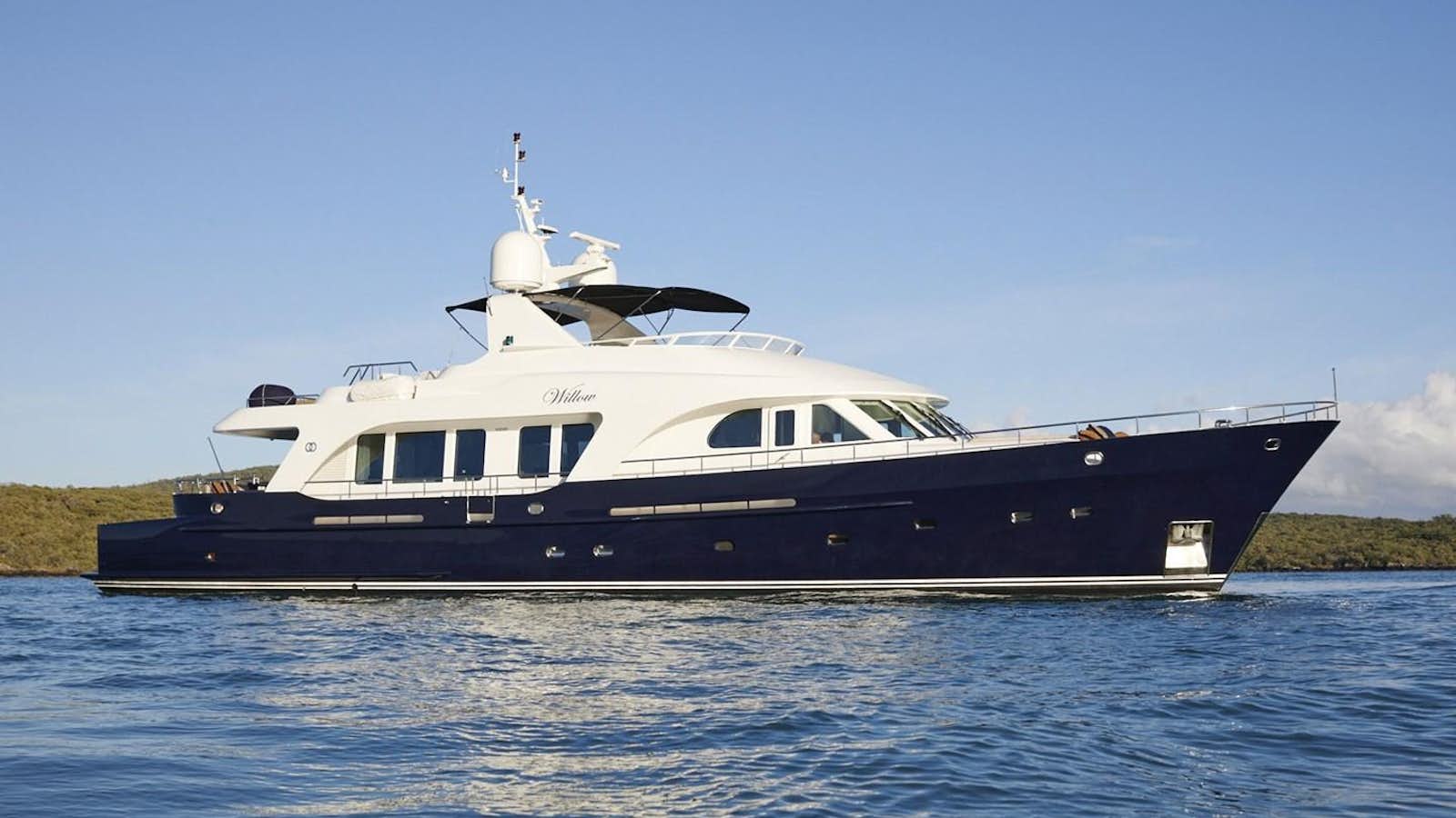 a large boat on the water aboard WILLOW Yacht for Sale