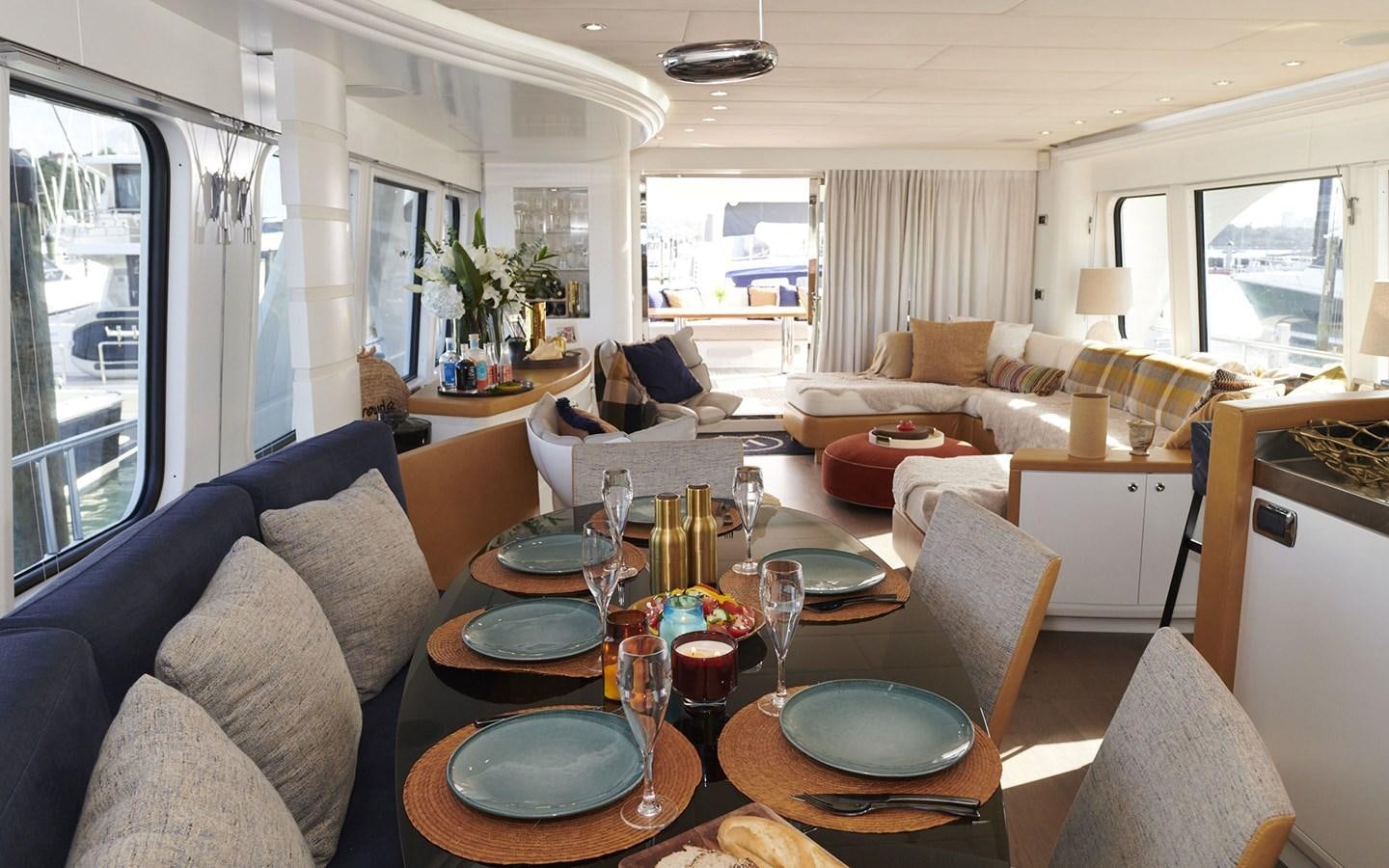 a living room with a table and chairs aboard WILLOW Yacht for Sale
