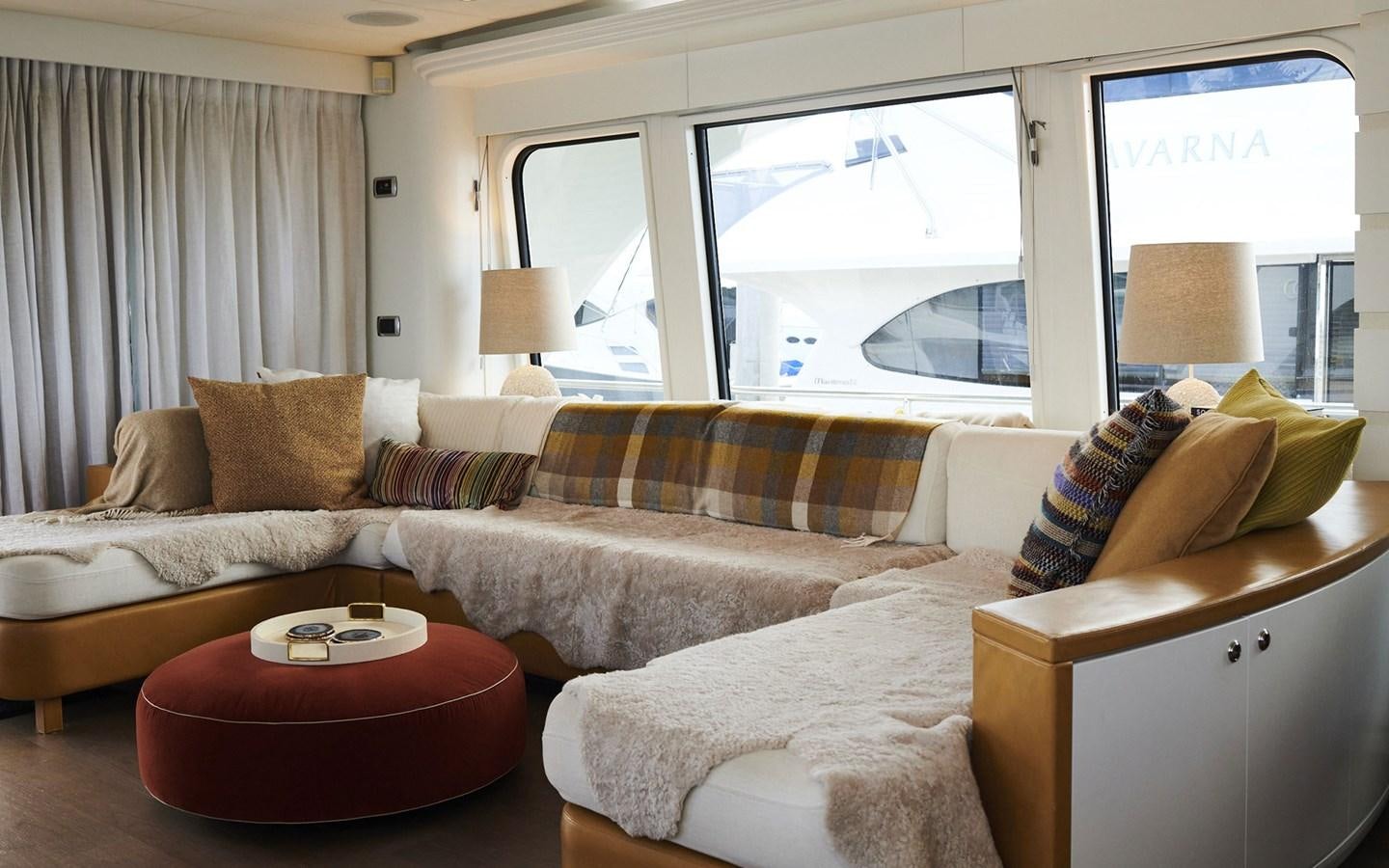 a living room with a couch and a table aboard WILLOW Yacht for Sale
