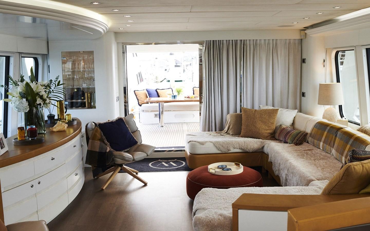 a living room with a couch and a table aboard WILLOW Yacht for Sale