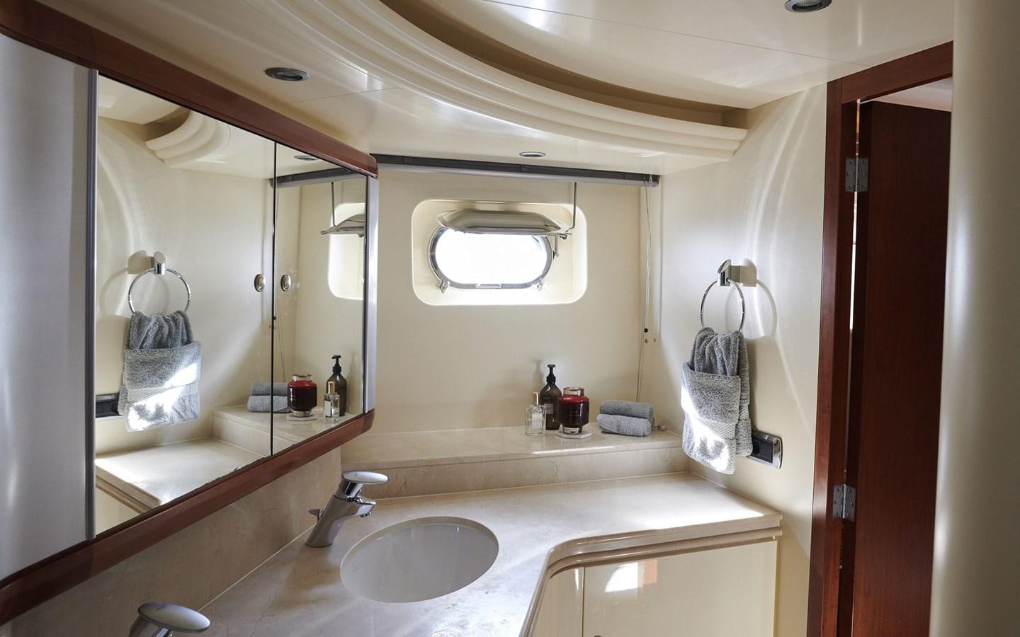 a bathroom with a large mirror aboard WILLOW Yacht for Sale