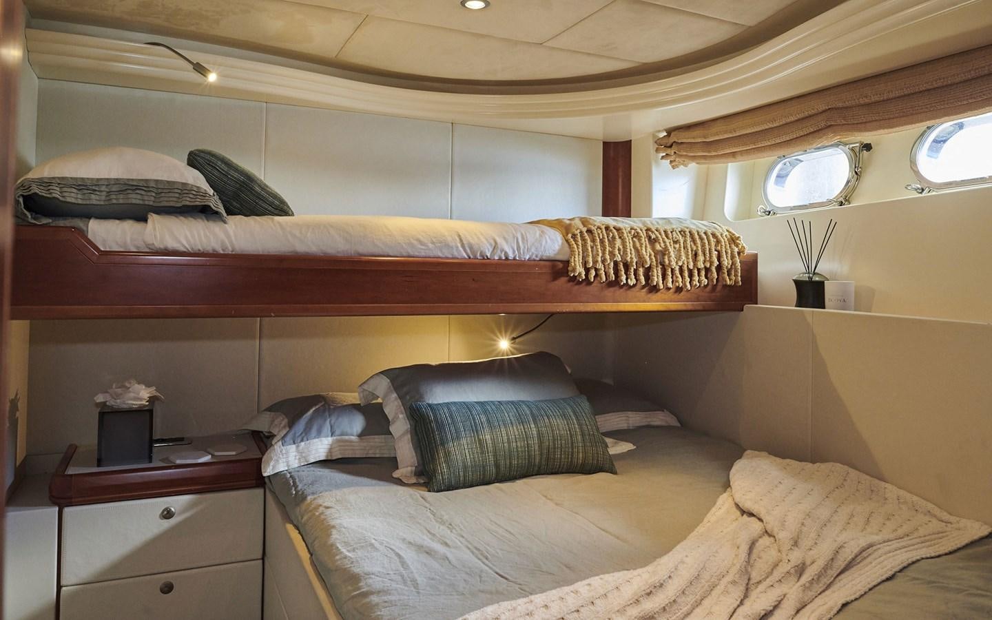 a room with a bed and a window aboard WILLOW Yacht for Sale