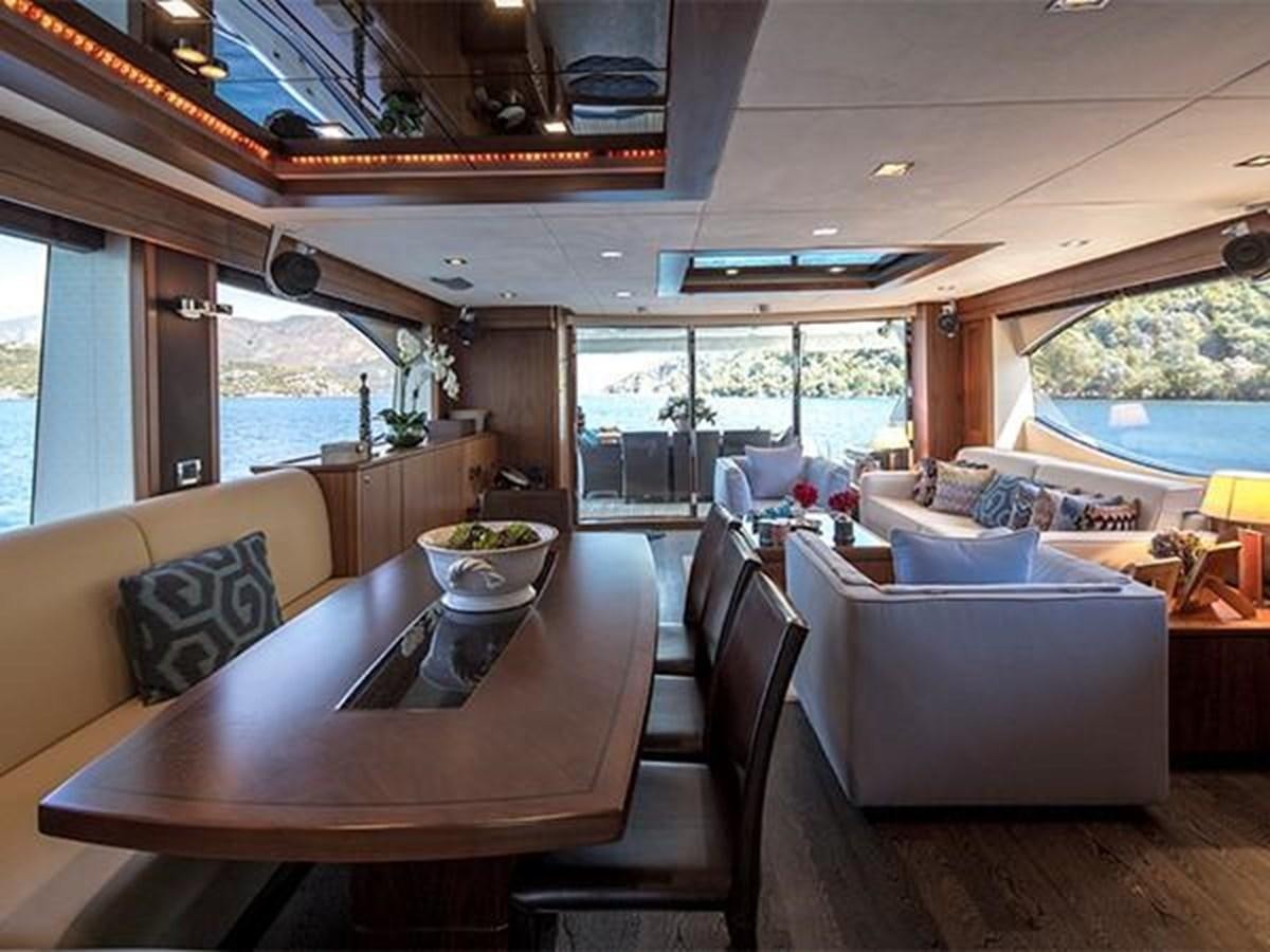 a dining table in a living room aboard UNIQUE NAZ Yacht for Sale