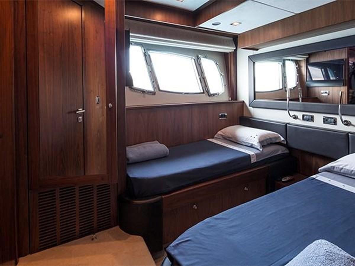 a room with a bed and a closet aboard UNIQUE NAZ Yacht for Sale