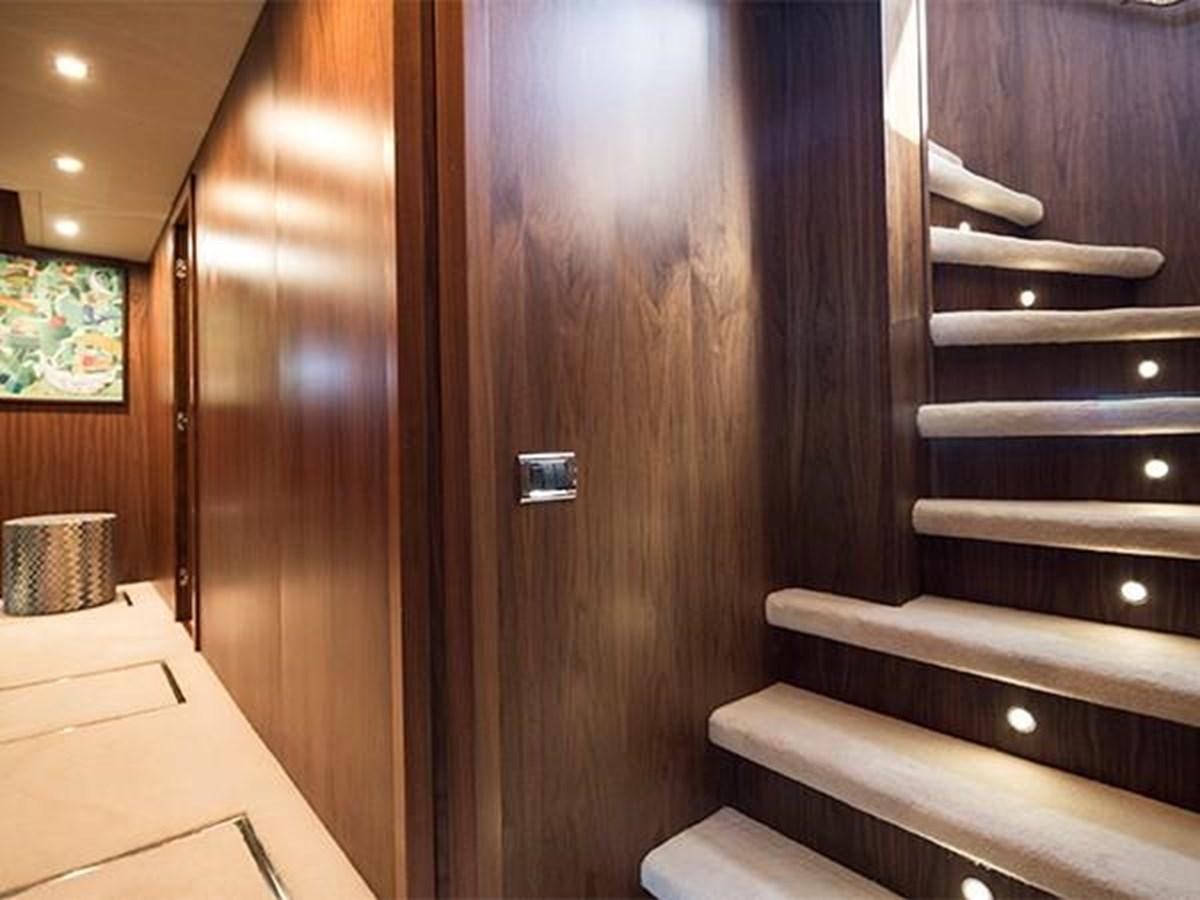 a wooden door with a wood paneled staircase aboard UNIQUE NAZ Yacht for Sale