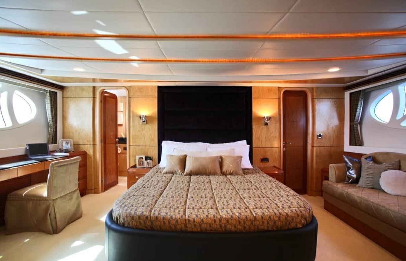 a hotel room with a bed and a desk aboard NEW OCEAN 88 Yacht for Sale