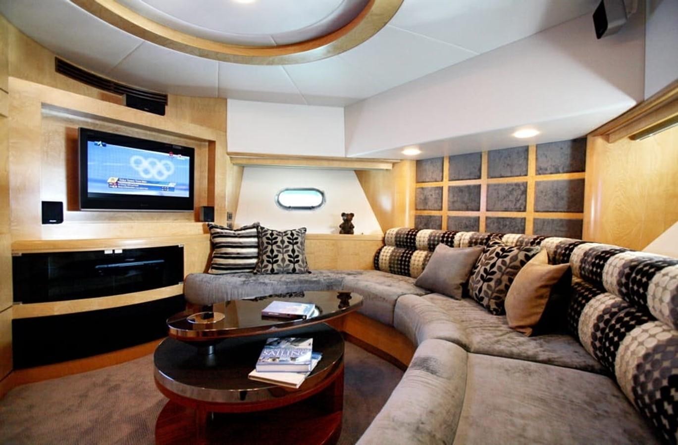 a living room with a large television aboard NEW OCEAN 88 Yacht for Sale