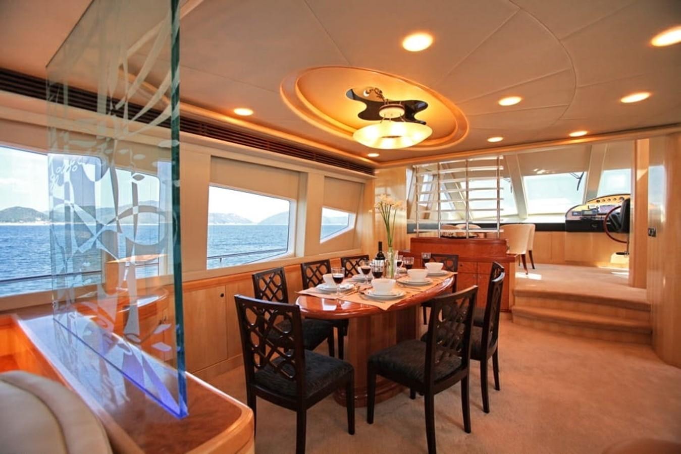 a dining room with a table and chairs aboard NEW OCEAN 88 Yacht for Sale