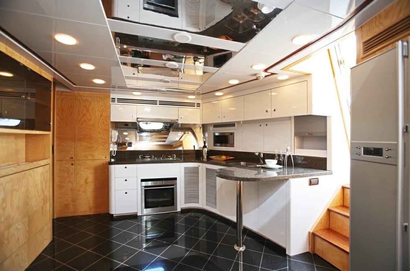 a kitchen with white cabinets aboard NEW OCEAN 88 Yacht for Sale