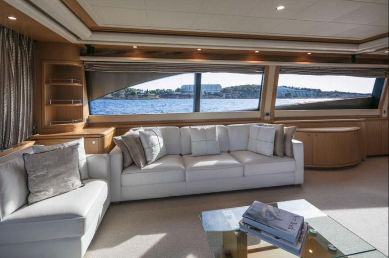 a living room with a large window aboard FAIR LADY SILVIA Yacht for Sale