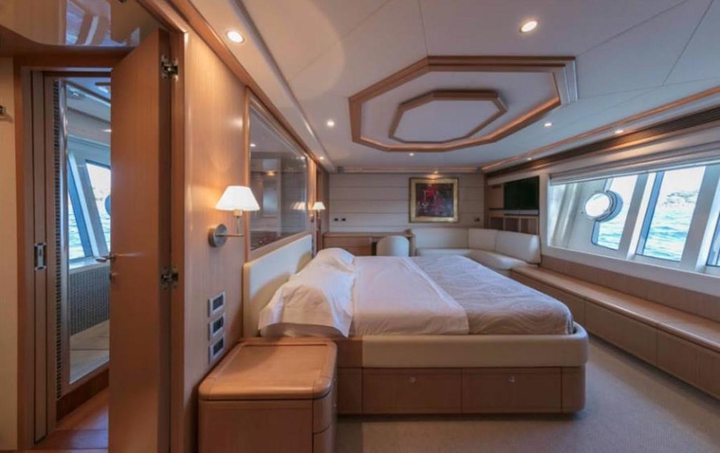 a room with a bed and a window aboard FAIR LADY SILVIA Yacht for Sale