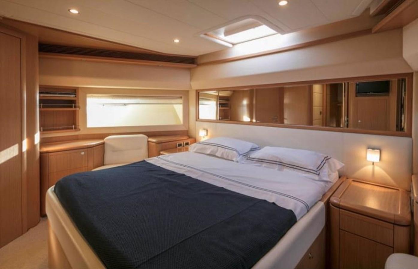 a room with a bed and a chair aboard FAIR LADY SILVIA Yacht for Sale