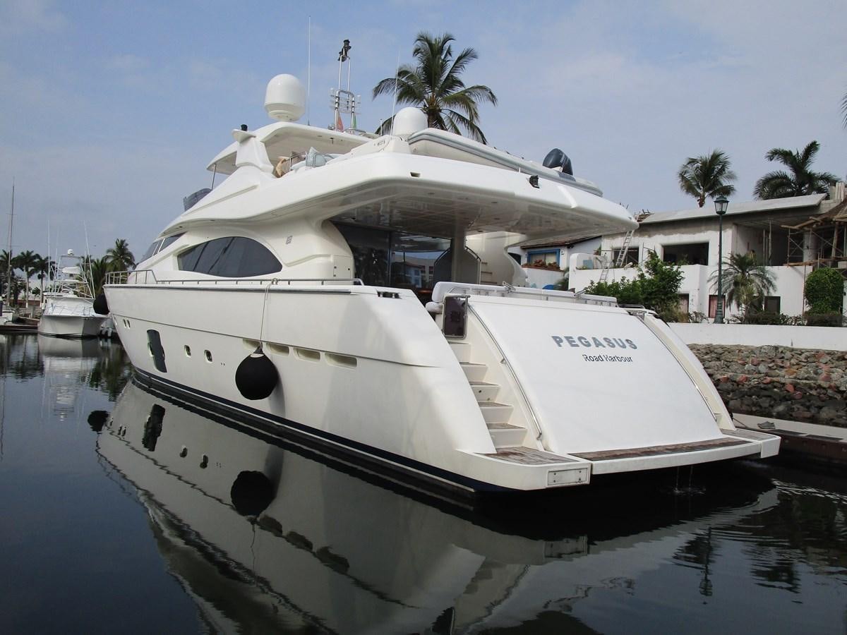 a white boat in a body of water aboard NACL Yacht for Sale